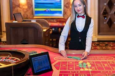 A Live Roulette dealer.
