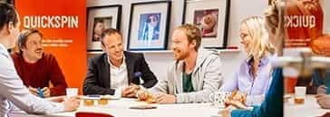 People at a conference table in the Quickspin head office in Sweden