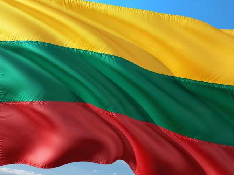 A tricolor flag with a yellow, green, and red stripe.