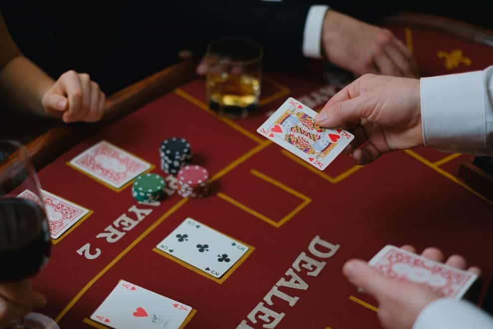 A croupier dealing cards in a casino.