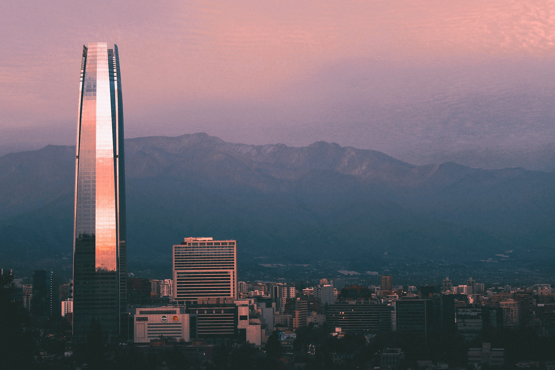 A skyscraper in Santiago, Chile at dusk.